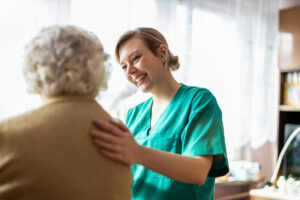 Nurse showing compassion to elderly lady